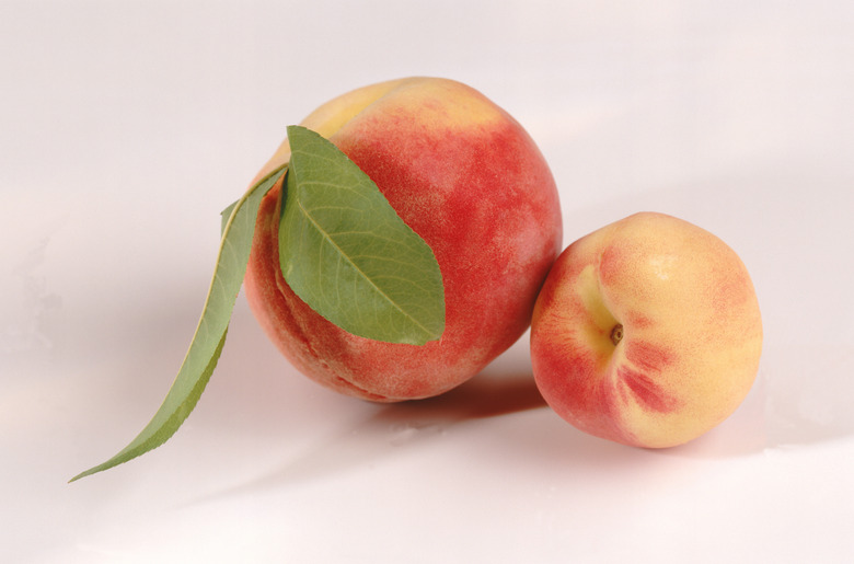Peach with lead on white background