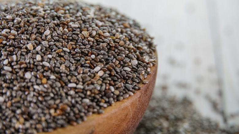 A bowl overflowing with chia seeds.
