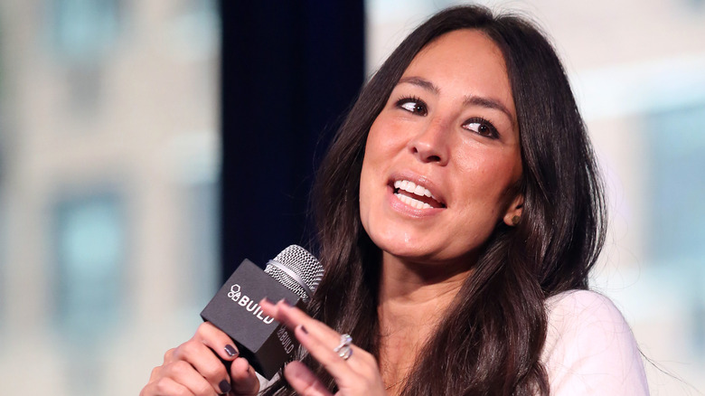 Joanna Gaines talking into a microphone