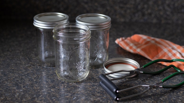 A trio of empty mason jars sit on the counter.