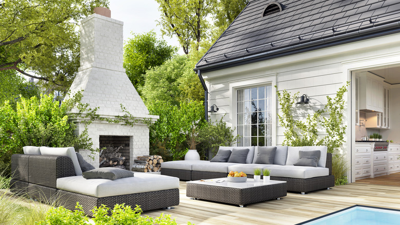 A patio area surrounded by foliage