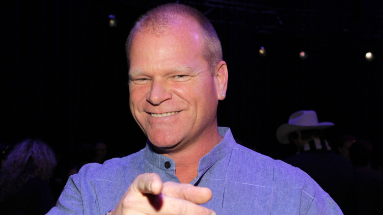 HGTV personality Mike Holmes points at the camera.