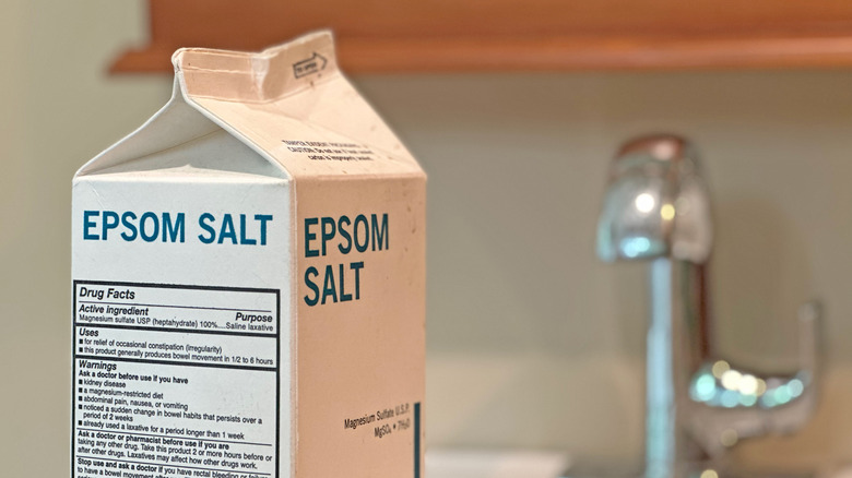 A carton of Epsom salt sits on the table.